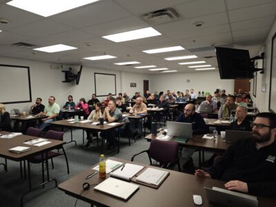 Participants listening to presentations