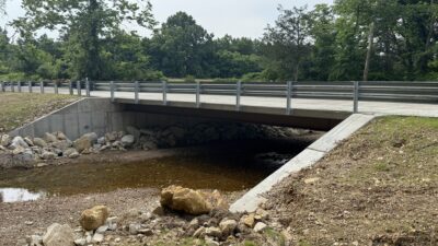 The Lockhart Road Bridge is a 41-ft 6-in span with a 28-ft roadway, supported by five W18×86 weathering steel girders spaced at 6 ft 2 in.