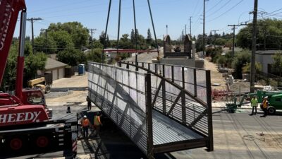 The main roadway crossing is installed during a scheduled 22-hour closure. The prefabricated steel sections were quickly placed into position to complete the critical crossing.