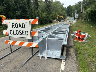 Galvanized press-brake tub girders staged for installation on a 69-foot bridge replacement project in Geauga County, Ohio, with forming services provided by Delta Steel and fabrication by Nelson Bridge Systems. Photo Credit: Nelson Bridge Systems